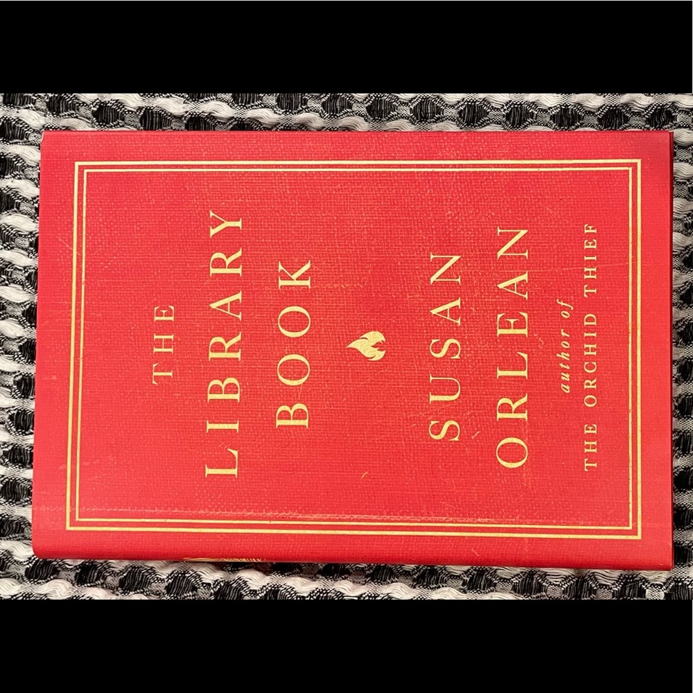 The library book by Susan Orlean, Hardcover. Excellent conditions.